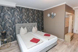 Postel nebo postele na pokoji v ubytování Second Home Hotel