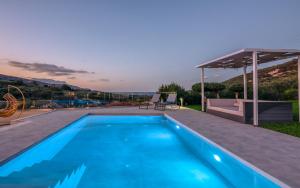 a swimming pool on the roof of a house at Casa Elea in Kissamos +95 photos