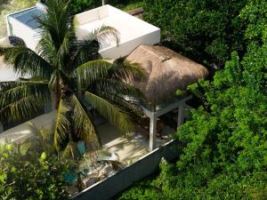 an overhead view of a building with a thatch roof at Villa Vera in Ahangama