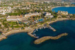 an aerial view of a resort near the water at Coral Beach Hotel & Resort Cyprus in Coral Bay