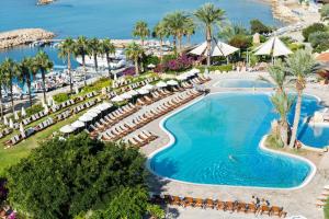 an overhead view of a swimming pool at a resort at Coral Beach Hotel & Resort Cyprus in Coral Bay
