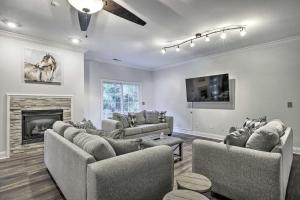 a living room with couches and a fireplace at Rustic Escape w Game Room and Modern Amenities in Pinehurst