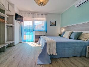 Ένα ή περισσότερα κρεβάτια σε δωμάτιο στο Casa Diamante Blu Mare