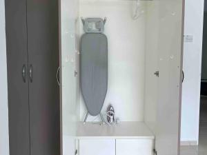a skateboard on a wall in a room at Trichrome Marina Island Minimalist Villa with Balcony in Lumut +29 photos