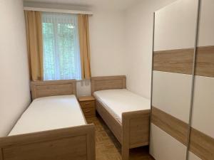 Postel nebo postele na pokoji v ubytování See-Hotel Post am Attersee