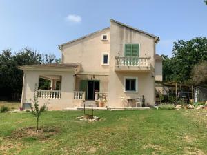 a large white house with a yard at U FARNIENTE in Patrimonio