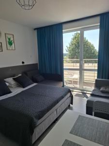 En eller flere senge i et værelse på Gwiazda nad Horyzont