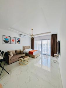 a living room with a bed and a couch at Modern Luxury Apartment in Aglantzia