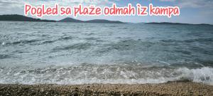 a picture of the ocean with the words polished so place ohmiculum k at Mobile home Ivan Vodice in Vodice +37 photos