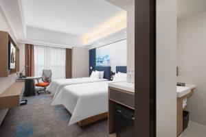 Voodi või voodid majutusasutuse Hampton by Hilton Chengdu Wuhou Waishuannan toas