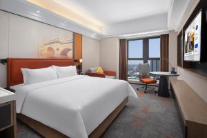 Voodi või voodid majutusasutuse Hampton by Hilton Chengdu Wuhou Waishuannan toas
