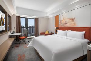 Voodi või voodid majutusasutuse Hampton by Hilton Chengdu Wuhou Waishuannan toas