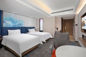 Voodi või voodid majutusasutuse Hampton by Hilton Chengdu Wuhou Waishuannan toas