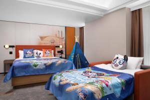 Voodi või voodid majutusasutuse Hampton by Hilton Chengdu Wuhou Waishuannan toas