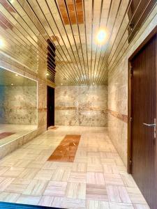 an empty room with a door and a tile floor at Vue exceptionnelle début Cap Corse La Pier Noire in San-Martino-di-Lota +26 photos