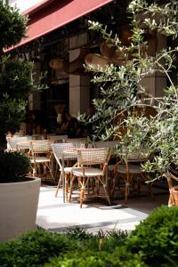 a group of tables and chairs in front of a building at Holiday Inn Nice by IHG in Nice