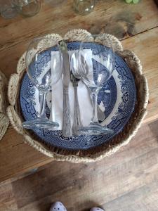a blue and white plate with silverware on a table at Low Gingerfield Farm B&B in Richmond