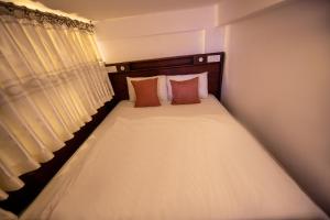 Ένα ή περισσότερα κρεβάτια σε δωμάτιο στο Vicrick Grand Residences