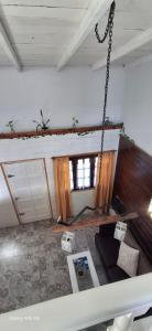 a living room with a couch and a swing at Ana home's in Mar del Plata