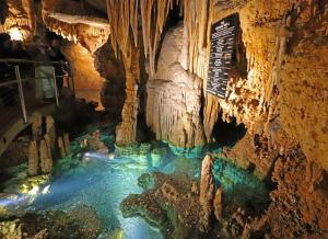 a cave with a pool of water in it at The Firefly Lodge at Shenandoah in Rileyville