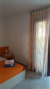 A bed or beds in a room at Il giardino dei tramonti