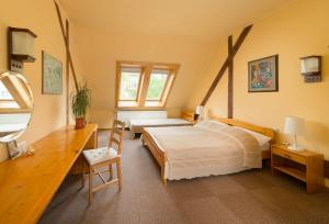 A bed or beds in a room at Hotel Abel Pension Budapest