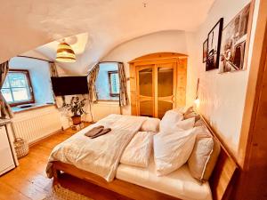 a bedroom with a large bed in a room at Gut Pirchnerbichl in Maishofen