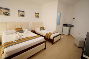 Letto o letti in una camera di Hotel Soan