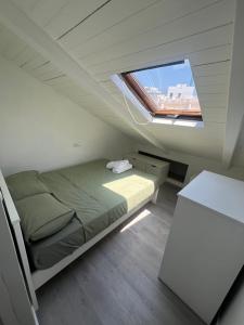 En eller flere senge i et værelse på Costa Azul Appartamento