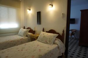 Postel nebo postele na pokoji v ubytování Montserrat Casa del Mar