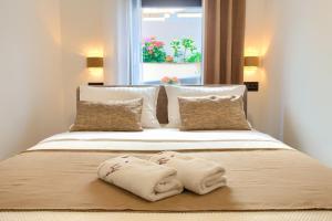Posteľ alebo postele v izbe v ubytovaní Apartments Sinisa - Krk Town