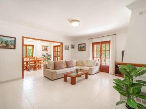 a living room with a couch and a coffee table at Holiday Home Lisboa by Interhome in Cala Murada