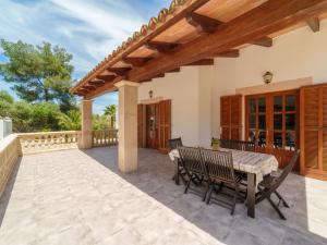 an outdoor patio with a table and chairs at Holiday Home Lisboa by Interhome in Cala Murada +23 photos