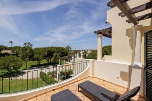 a balcony of a house with chairs and a view at Vale Do Lobo Resort in Vale do Lobo