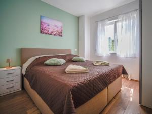 Postel nebo postele na pokoji v ubytování Apartment Lucija-2 by Interhome