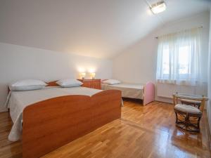 En eller flere senge i et værelse på Apartment Olga-5 by Interhome