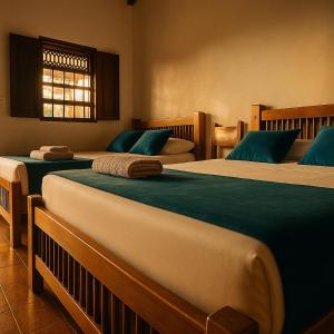 Postel nebo postele na pokoji v ubytování Hotel Dulce Campestre