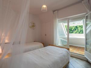 Postel nebo postele na pokoji v ubytování Apartment Belle Vue Mer by Interhome