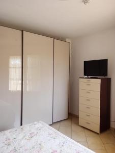 TV a/nebo společenská místnost v ubytování Il Palco residence