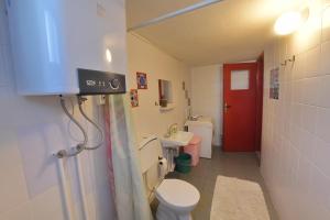 a small bathroom with a toilet and a sink at Mimas Garden Apartments in Karaburun +36 photos