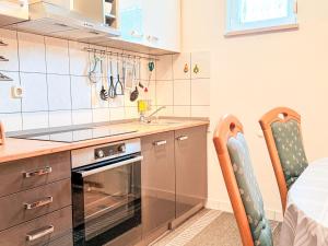a kitchen with a sink and a stove top oven at Apartment Marija-2 by Interhome in Pridraga