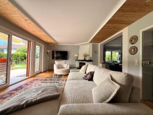a living room with a couch and a table at Ferienhaus Sonnenschein in Bad Reichenhall