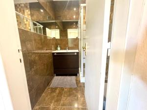 a bathroom with a sink and a mirror at THE Estoril Studio in Estoril +22 photos