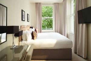 Ένα ή περισσότερα κρεβάτια σε δωμάτιο στο Hotel Xenia - Autograph Collection