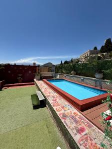 a swimming pool on the roof of a house at Casa Bucalo Taormina in Taormina