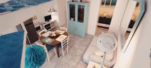 an aerial view of a room with a table and a bedroom at La casa Rosa 2 in Ponza