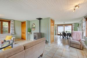 a living room with a couch and a table at Sun Sea vakantiehuis in Middelkerke