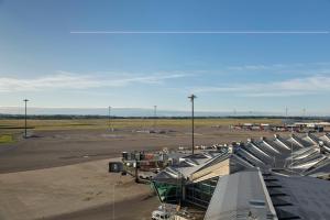 a view of an airport with an airport terminal at Moxy Lyon Airport in Saint-Exupéry
