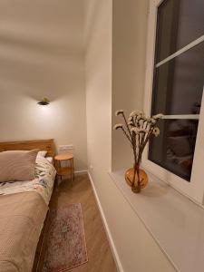 Postel nebo postele na pokoji v ubytování Apartament Frombork Łempicka