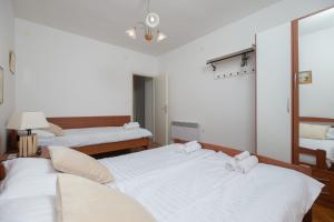 En eller flere senge i et værelse på Apartment Val 2